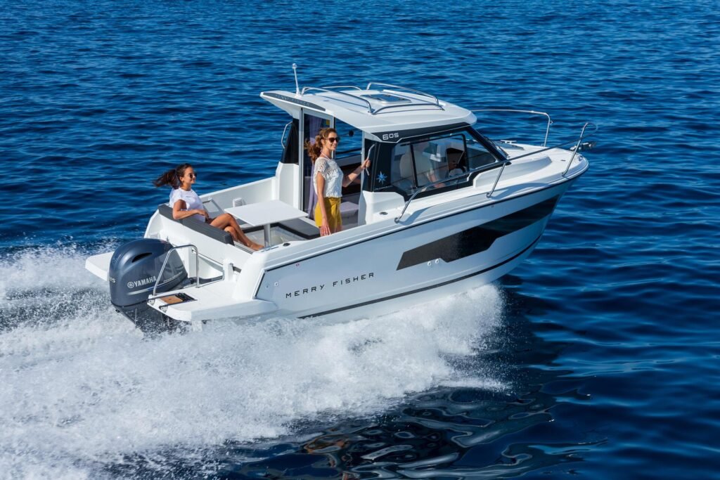 French outboard yacht for sixteen guests, at speed on the water