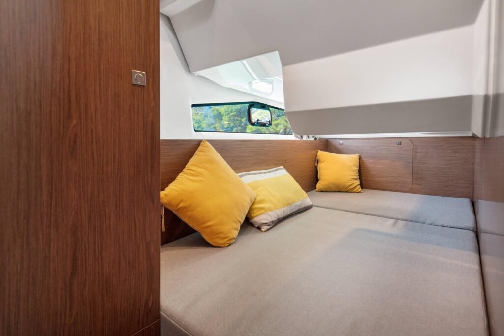 11 metre planing yacht with 3 cabins at anchor