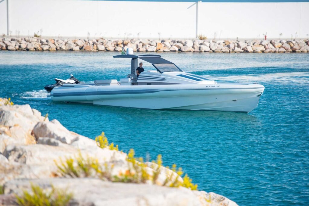 16 guest planning yacht from Italy, anchored in clear waters