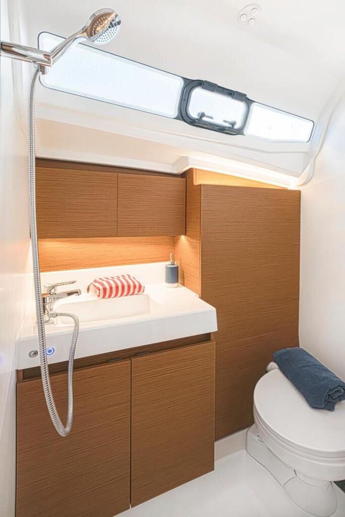monohull sailing yacht around 100,000€ for sale, exterior on the water