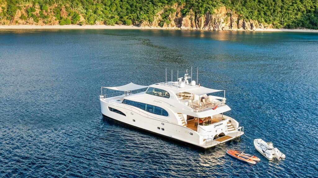 22 metre 4 cabin catamaran yacht at anchor in calm waters