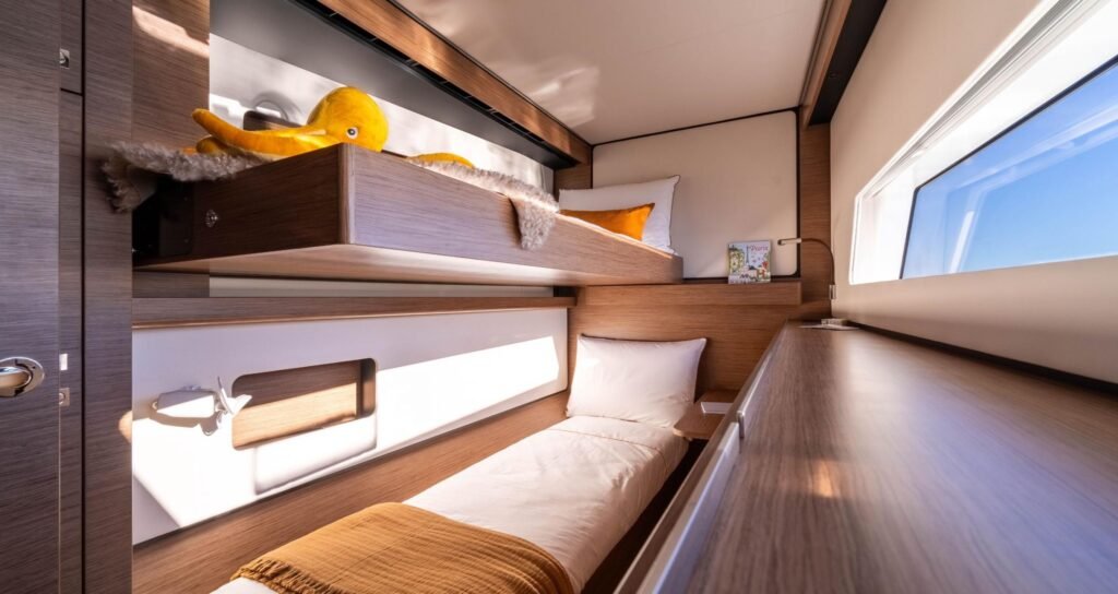displacement sailing catamaran for sale, exterior on the water