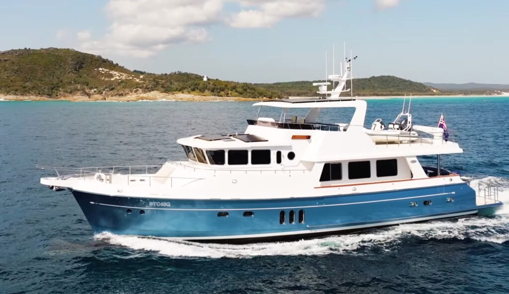 semi displacement trawler at anchor in harbour