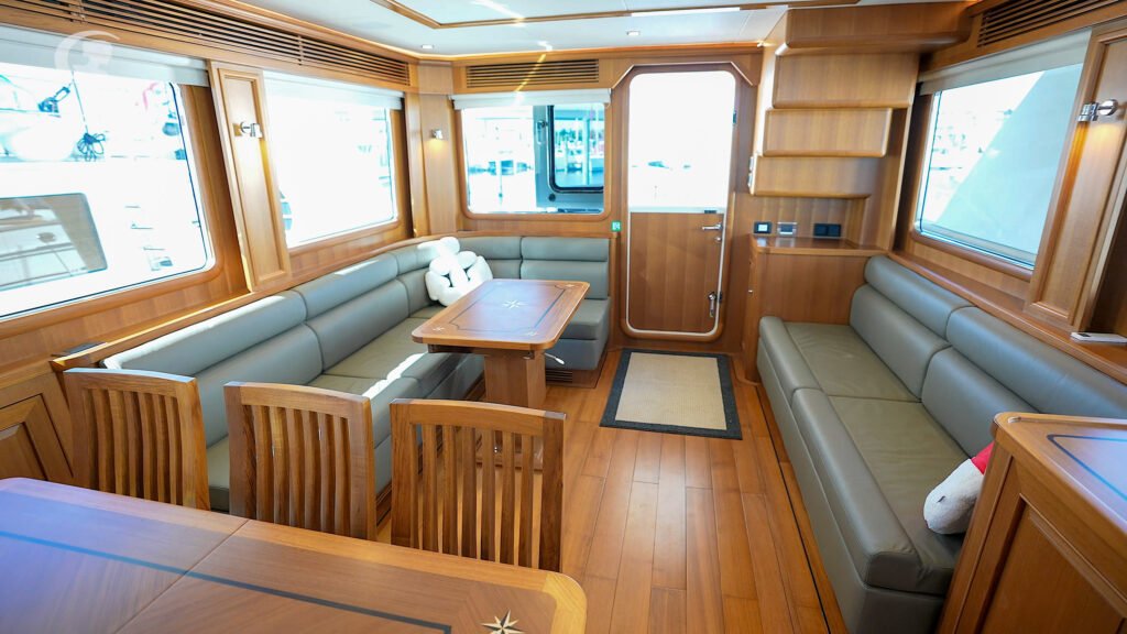 12 guest trawler yacht built in China for sale, exterior on the water