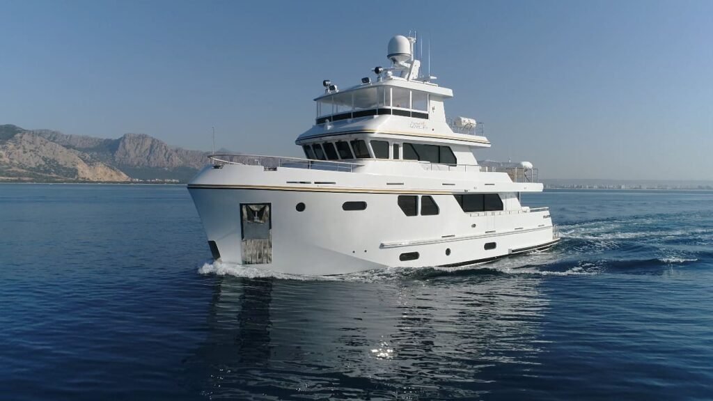 aluminium semi displacement yacht for sale, exterior on the water