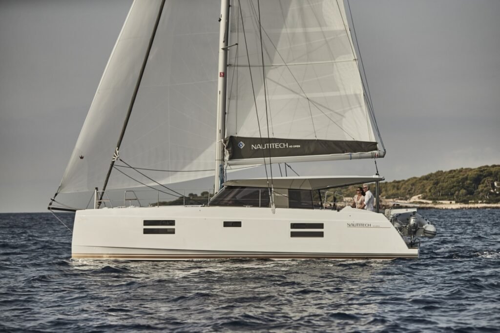 12 metre French GRP yacht cruising along the coastline