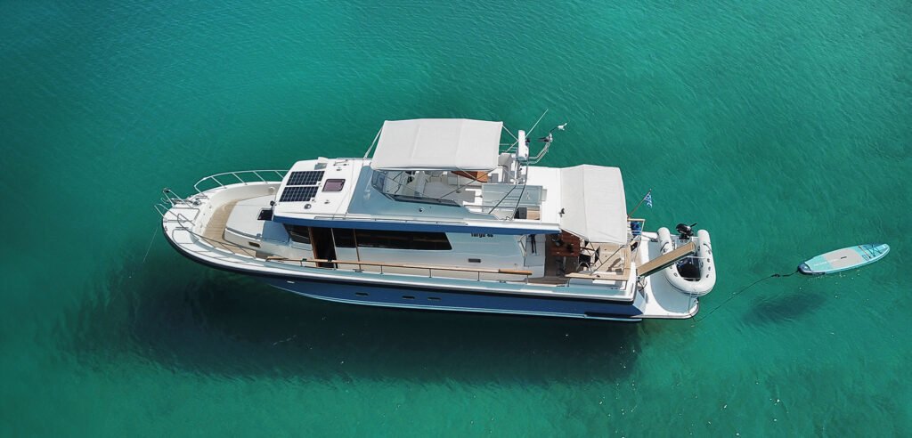 2 cabin planing hull Finnish yacht cutting through waves