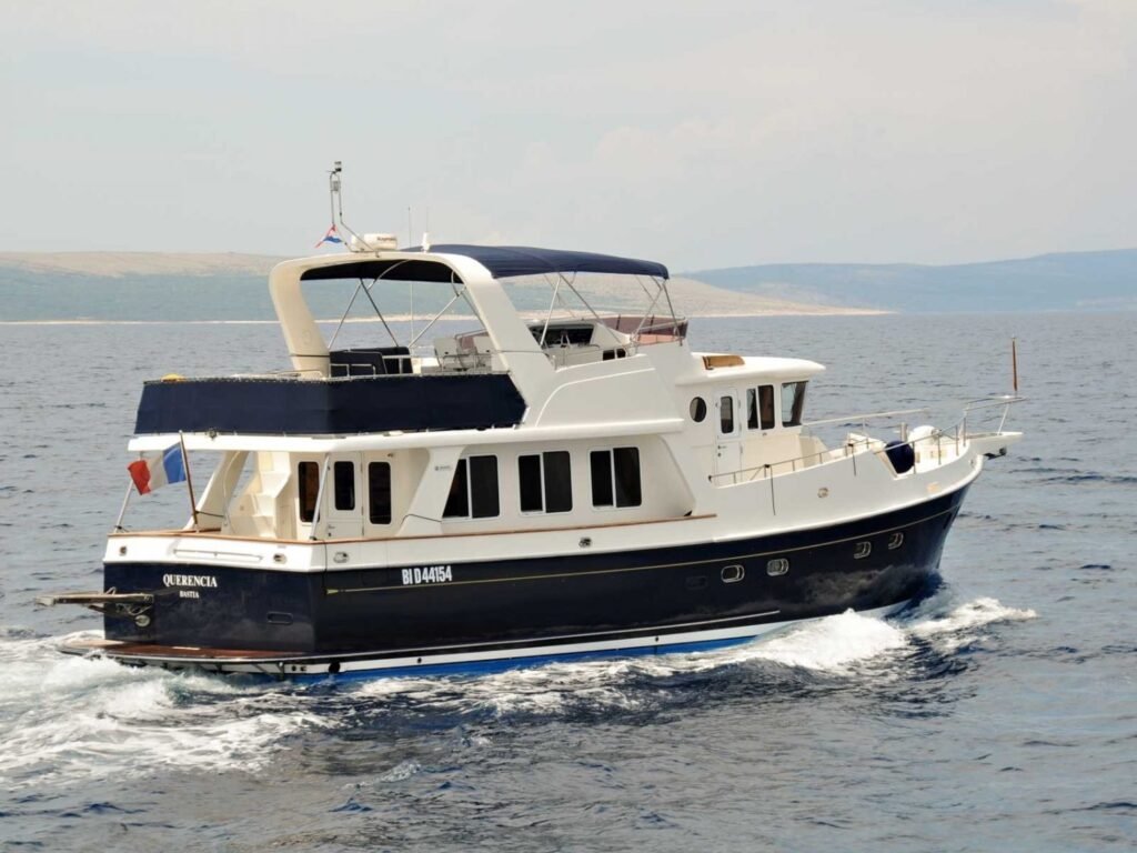 Semi displacement trawler yacht at anchor