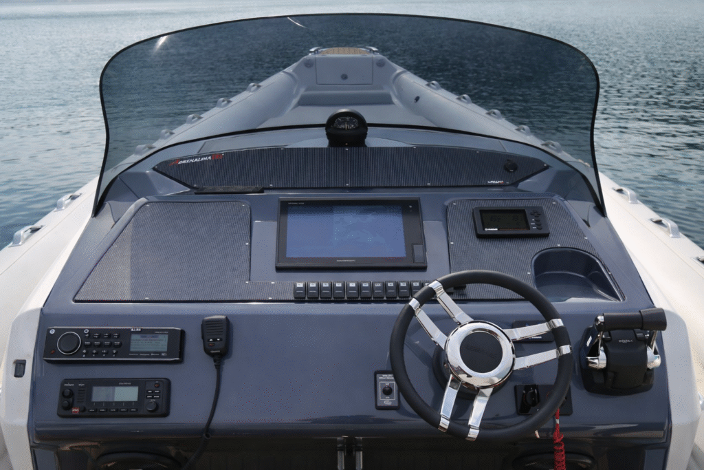 11 metre planning RIB at anchor with crew aboard