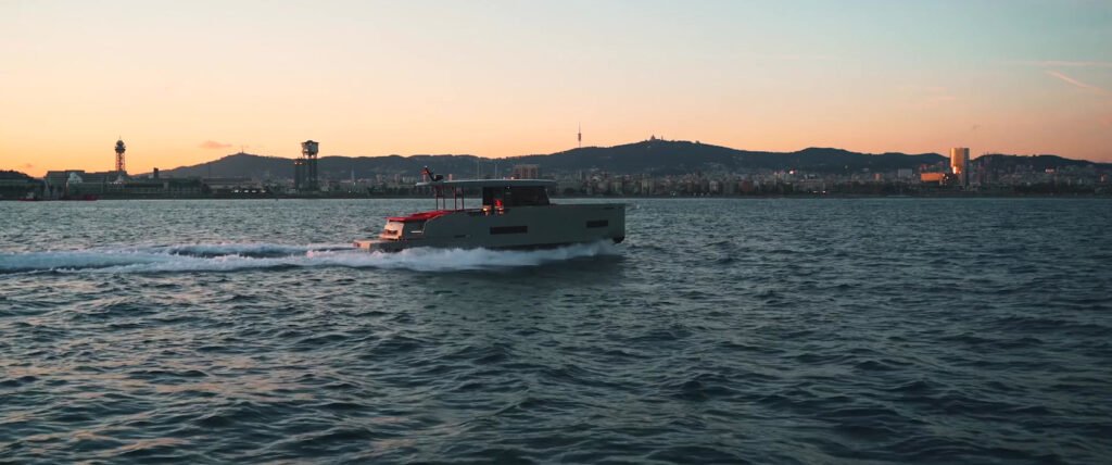 2 cabin coupe yacht around 900,000 euros, sleek profile on water