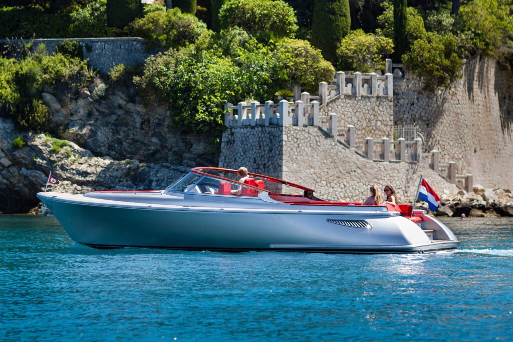 12 metre inboard planing yacht anchored in a bay