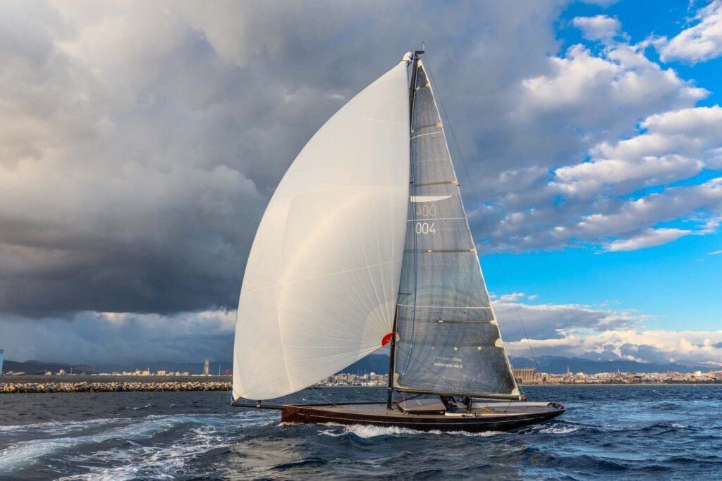 12 metre monohull yacht for 8 guests, at anchor with tender