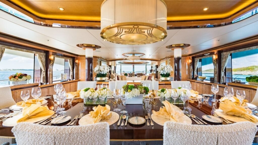 Formal dining room set for the full party beneath a chandelier