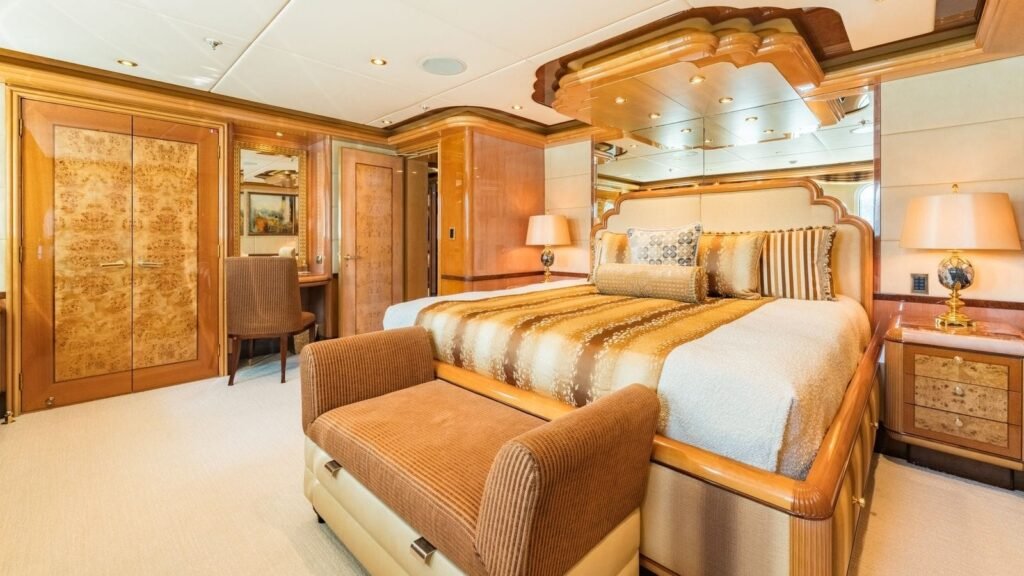 Stateroom in gold and burl wood tones