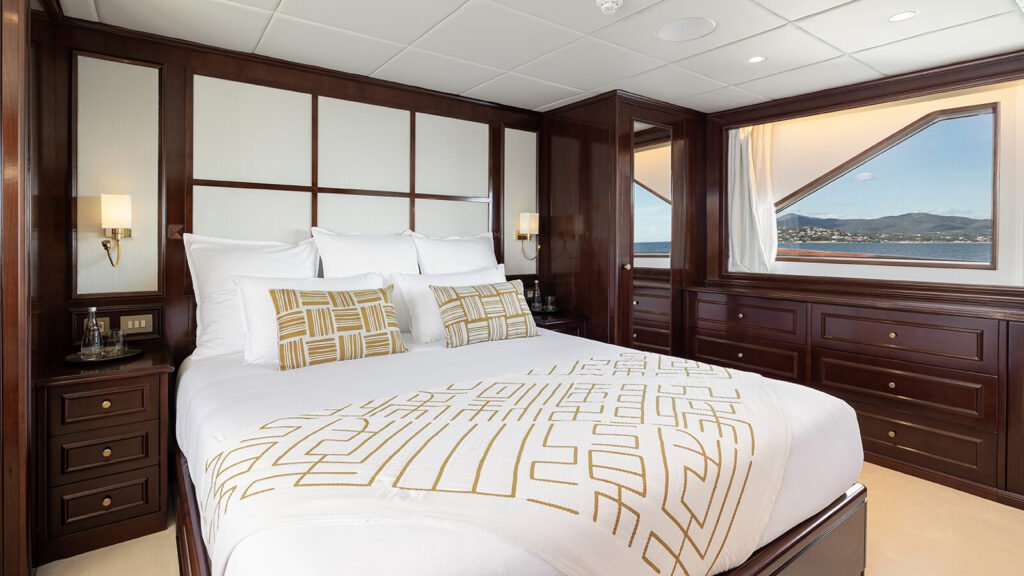 Master suite in white panelling with gold accents