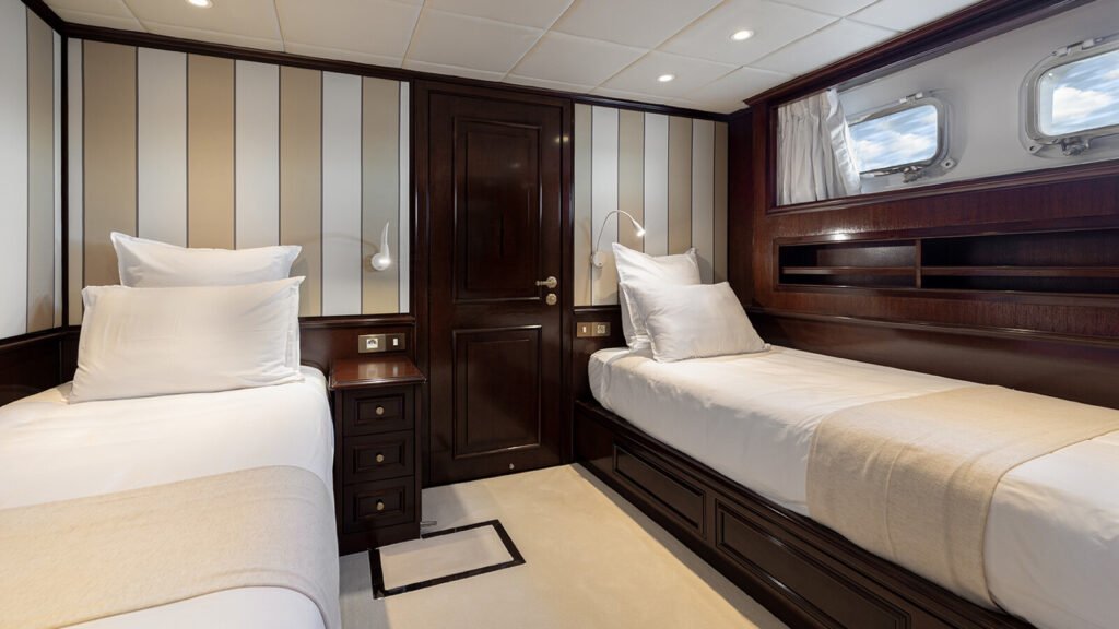 Twin stateroom in beige and cream tones
