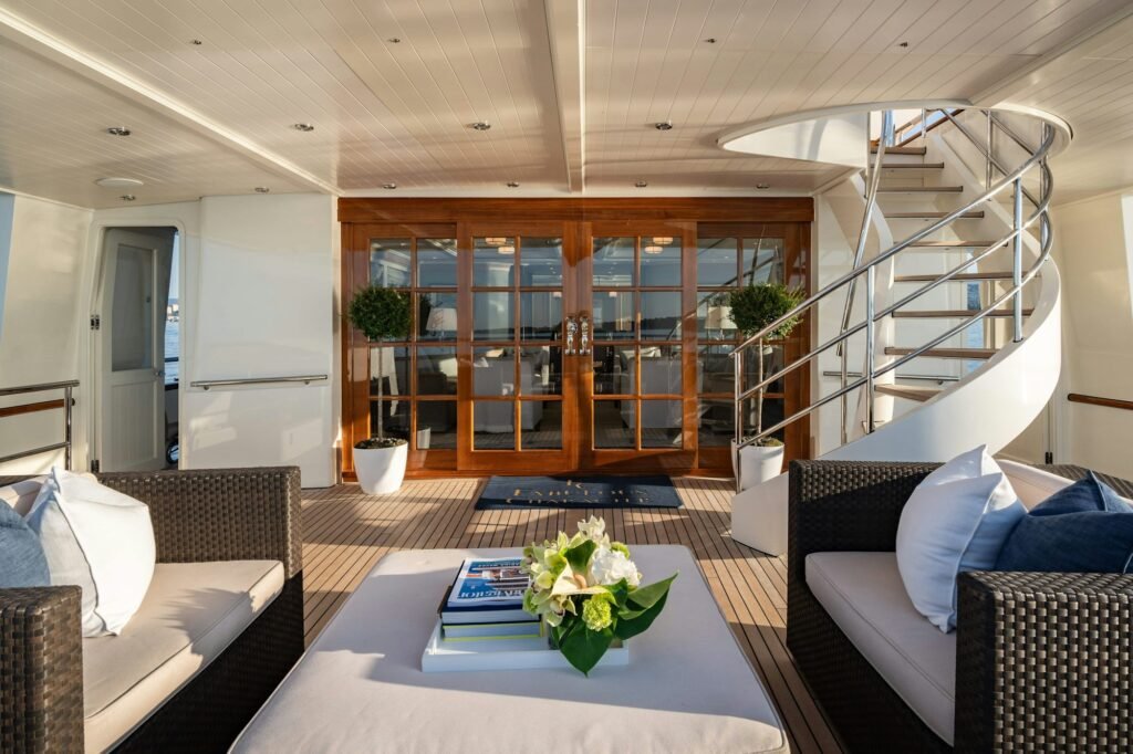 Motor charter yacht with e-foil, cruising at sea