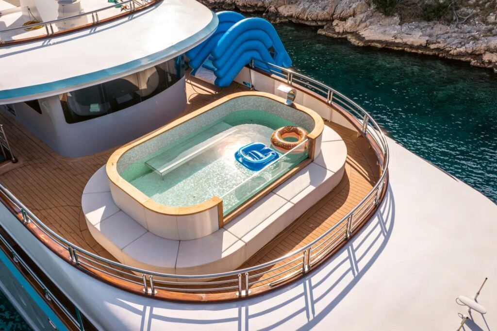 Family yacht with waterslide, sun deck and pool area