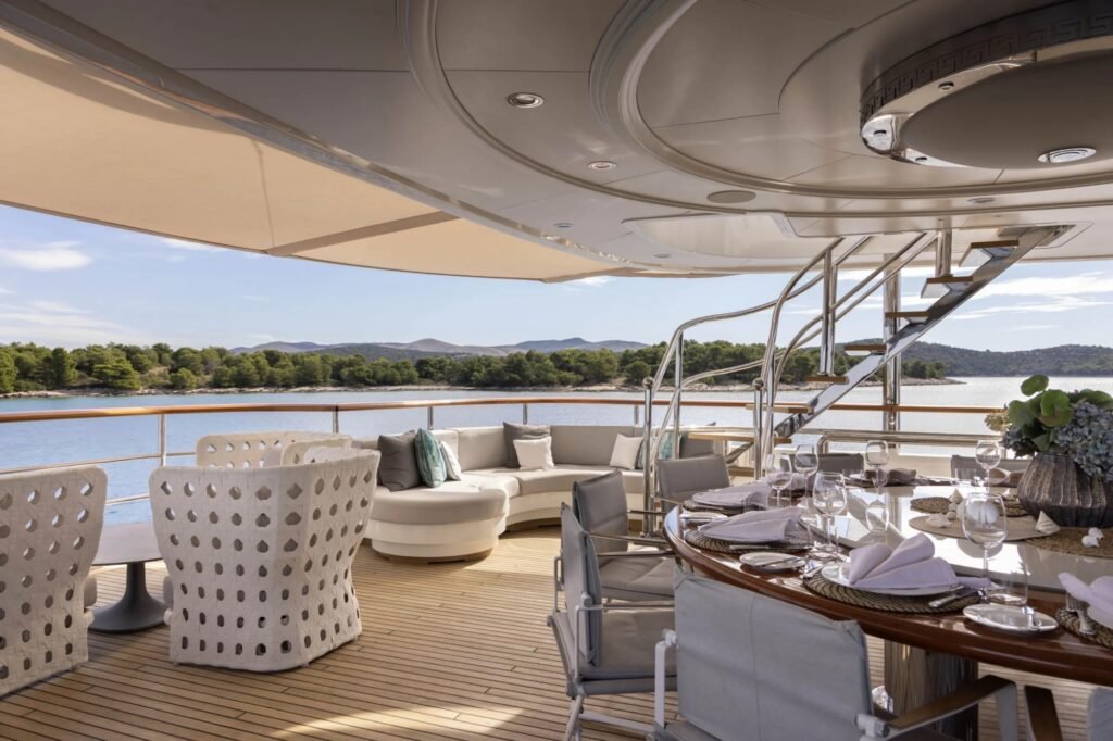 Charter yacht with fold out terraces, exterior profile at anchor