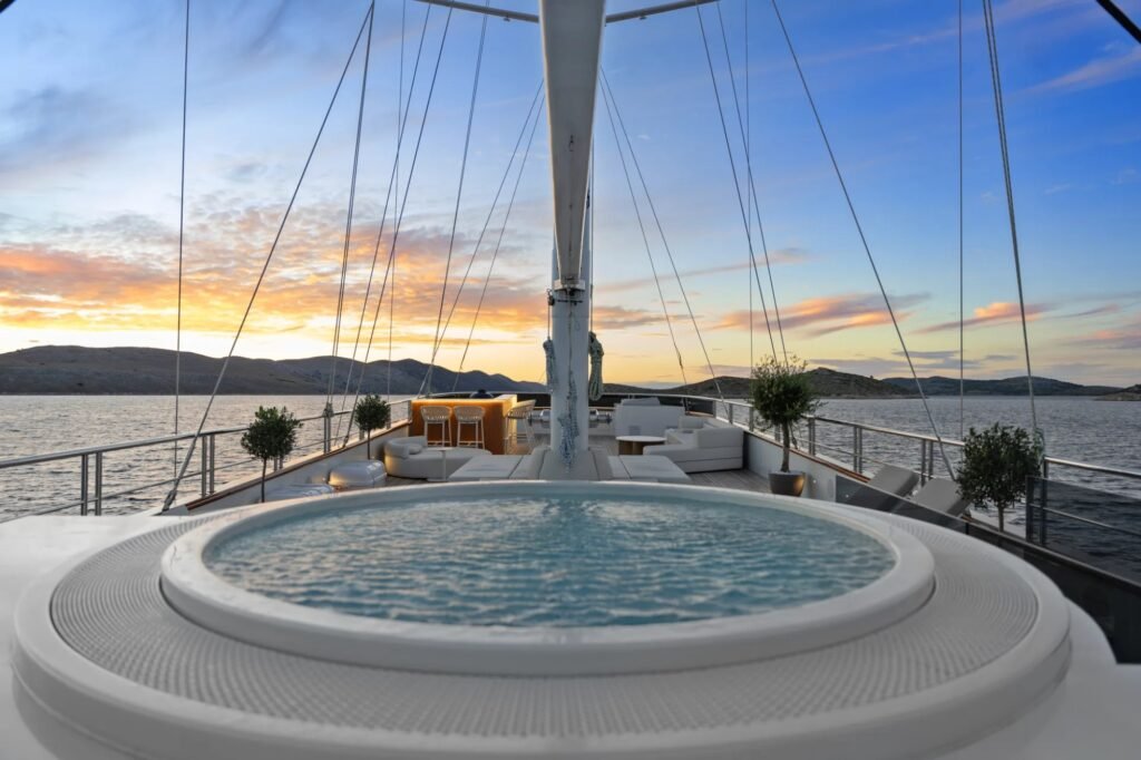 Beach club and waterslide charter yacht, sun deck and upper decks