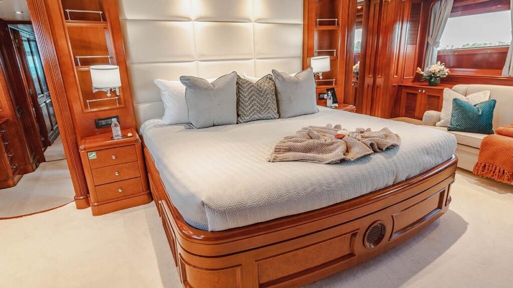 Master stateroom with queen bed, mahogany panelling