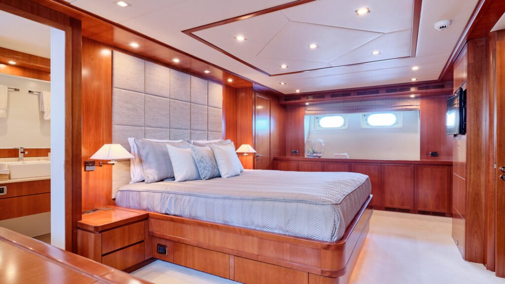 VIP stateroom with king bed and en-suite bathroom visible