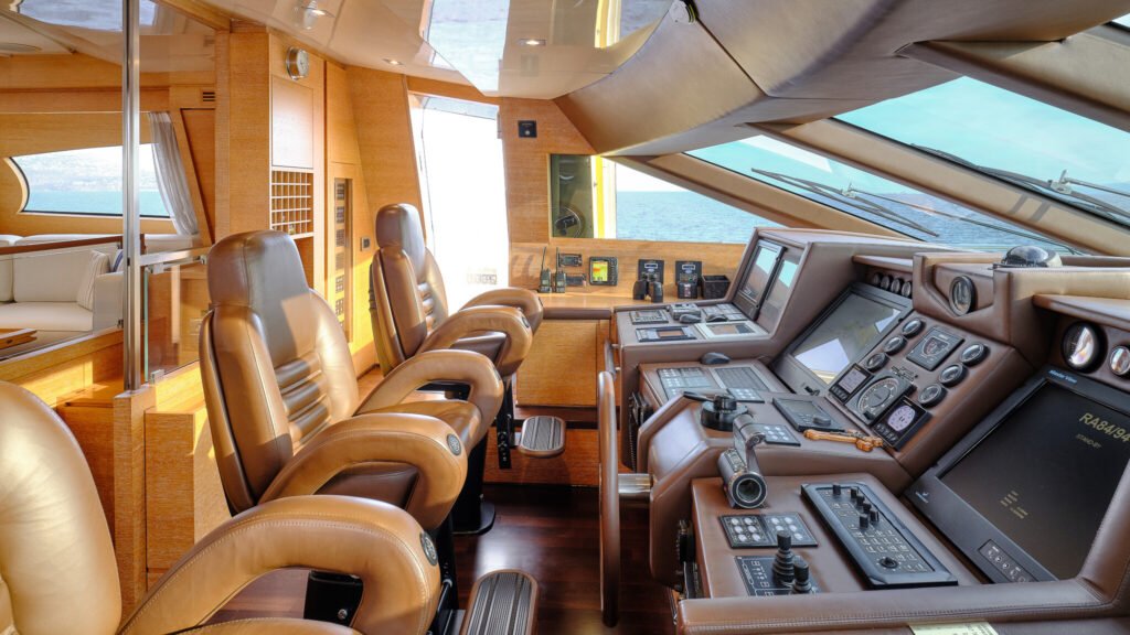 Wheelhouse with leather helm seats and navigation controls