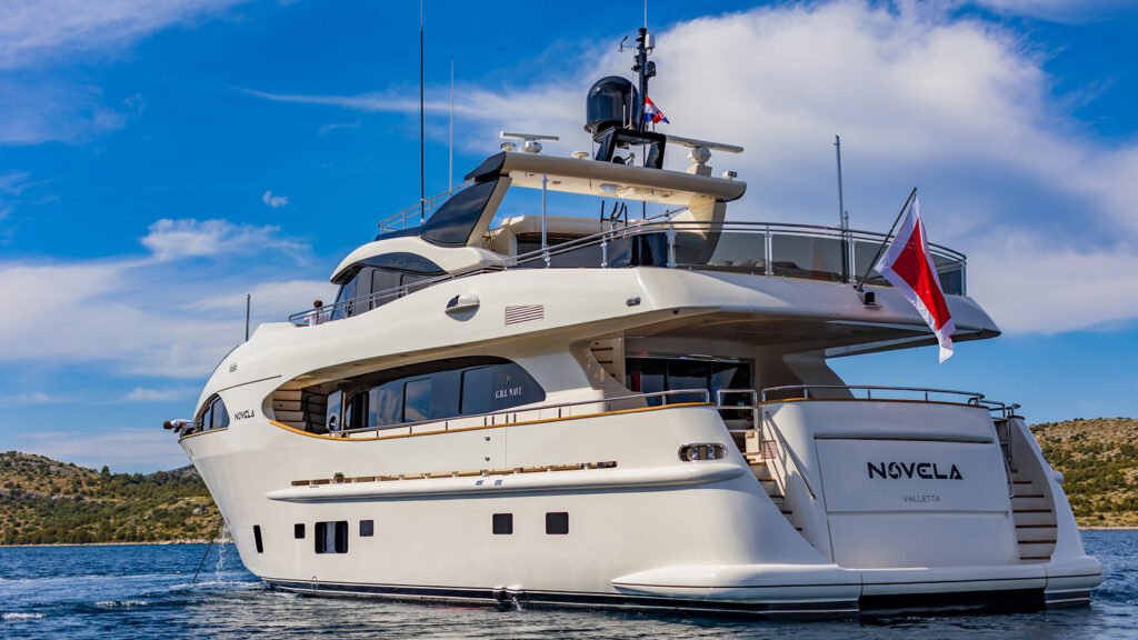 NOVELA starboard profile at anchor, name on the hull