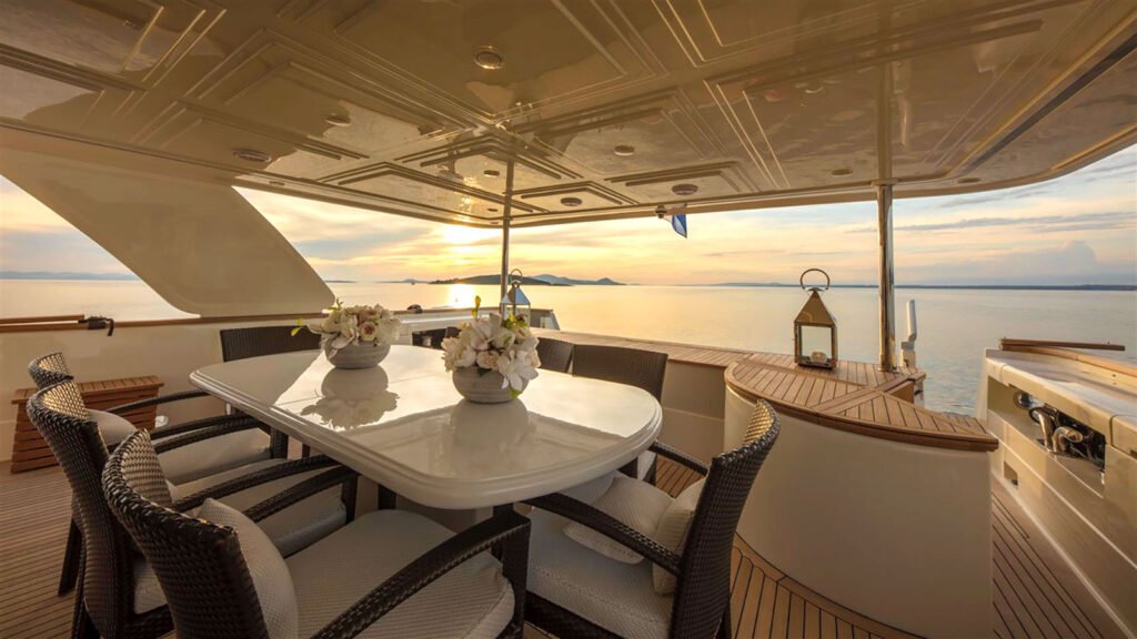 ENA aft deck dining table at sunset