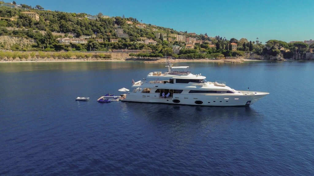 Aerial view of motor yacht Centurion at anchor in a bay on the French Riviera