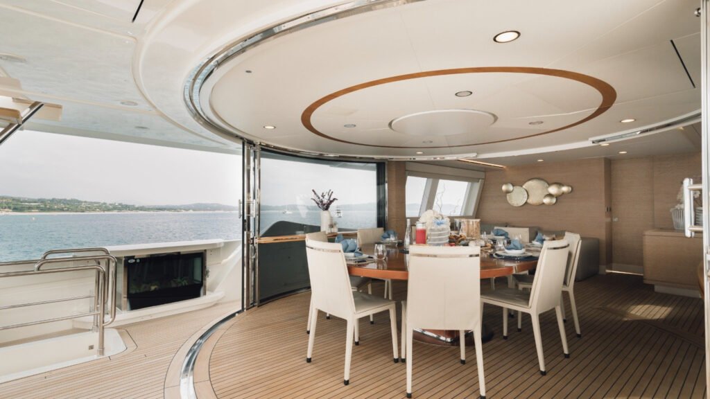 Formal dining area with oval ceiling detail aboard motor yacht Centurion