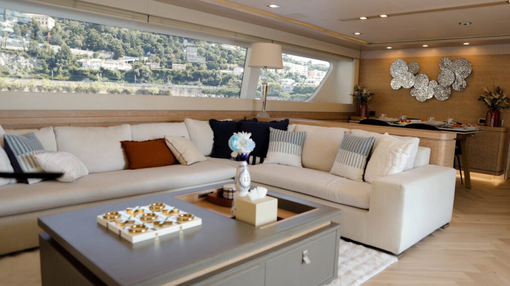 Main salon lounge with white sofas and modern decor aboard motor yacht Centurion