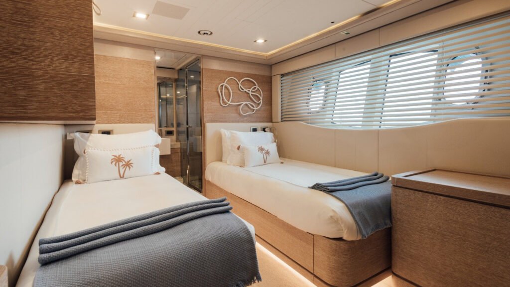 Guest cabin with double bed and contemporary decor aboard motor yacht Centurion
