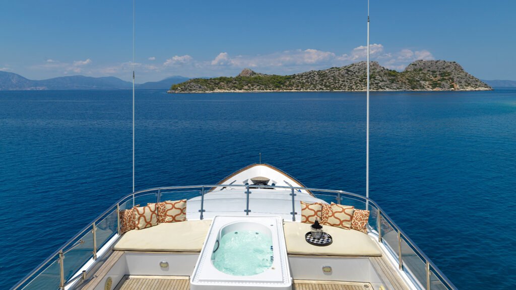 Singapore charter classic yacht, teak deck and rig profile at sea
