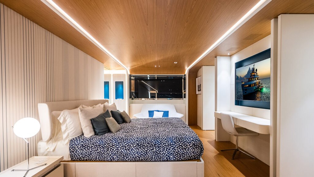 Guest cabin aboard KOJU with desk and screen