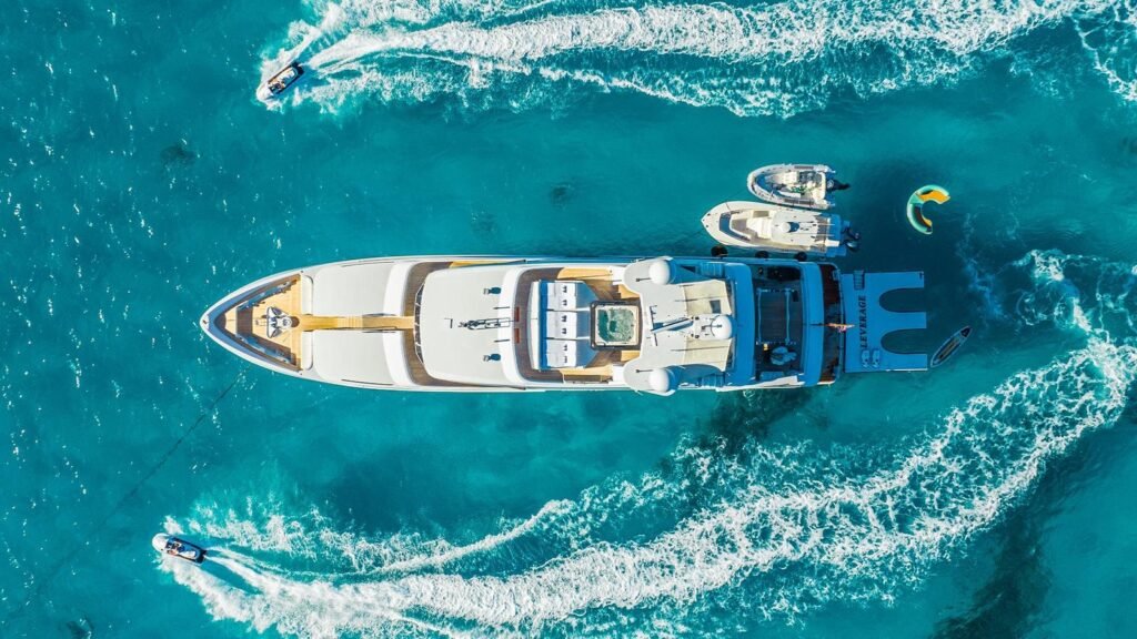 Aerial view of LEVERAGE with kiteboarder and jet ski