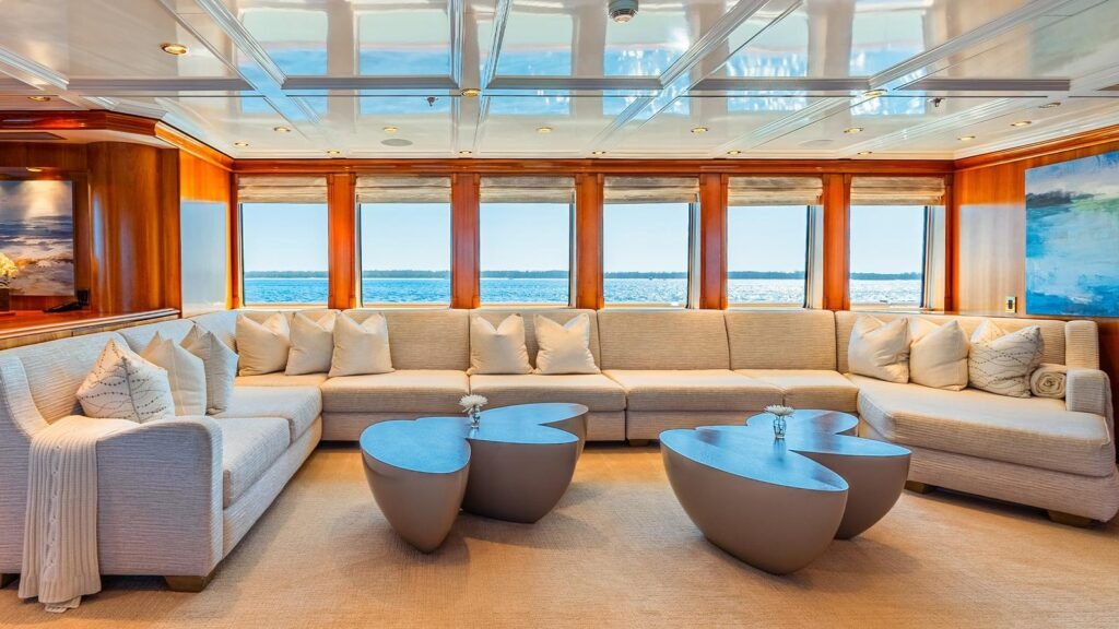 Main salon sectional and mirrored coffered ceiling aboard LEVERAGE