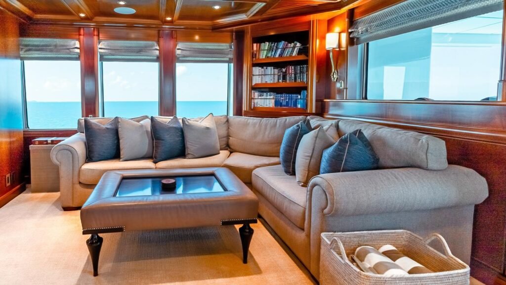 Skylounge sitting area and bookcase aboard LEVERAGE