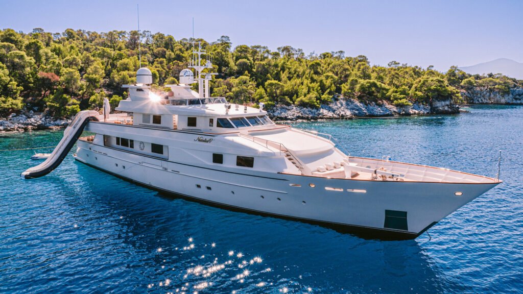 Classic yacht exterior, aft deck and dinghy in the Bahamas
