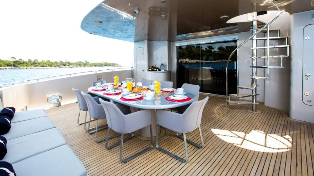 PANDION aft deck dining and spiral stair