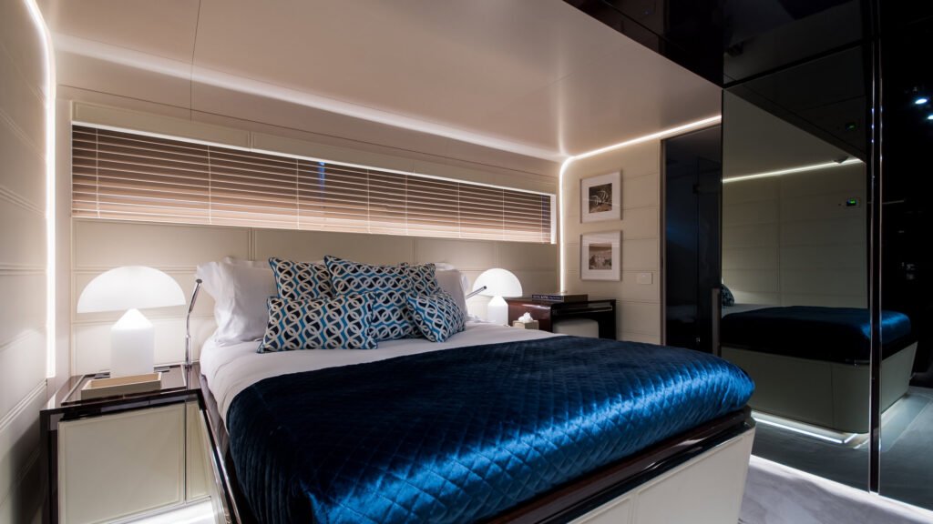 SOULMATE VIP stateroom with blue linens and elegant fixtures