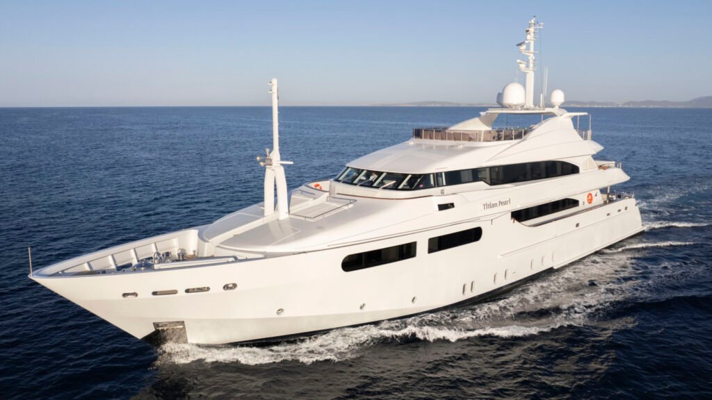 Crewed motor yacht exterior at anchor in Spain, West Mediterranean charter