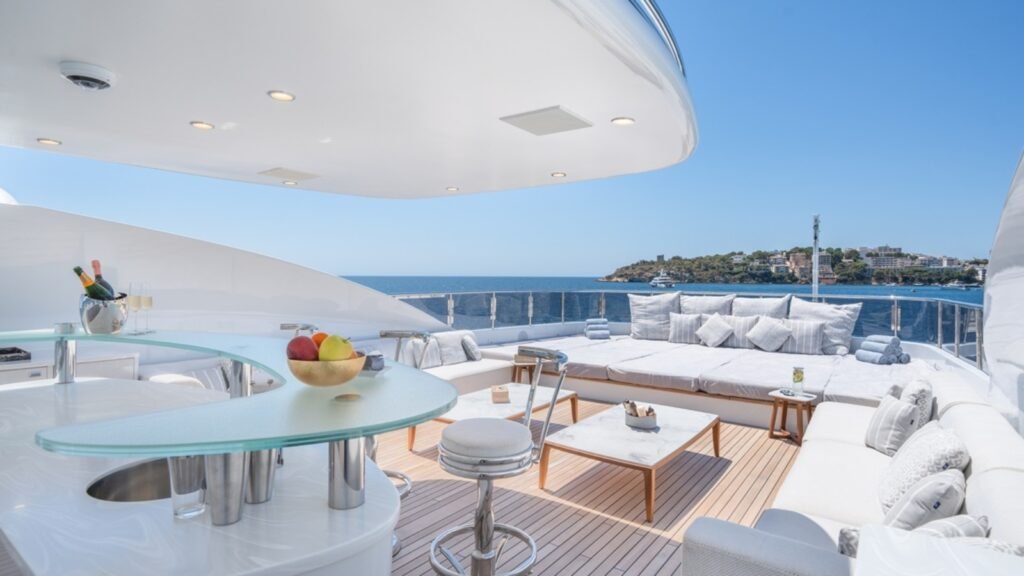 Balearics motor charter yacht, aft deck at Mallorca cove anchorage