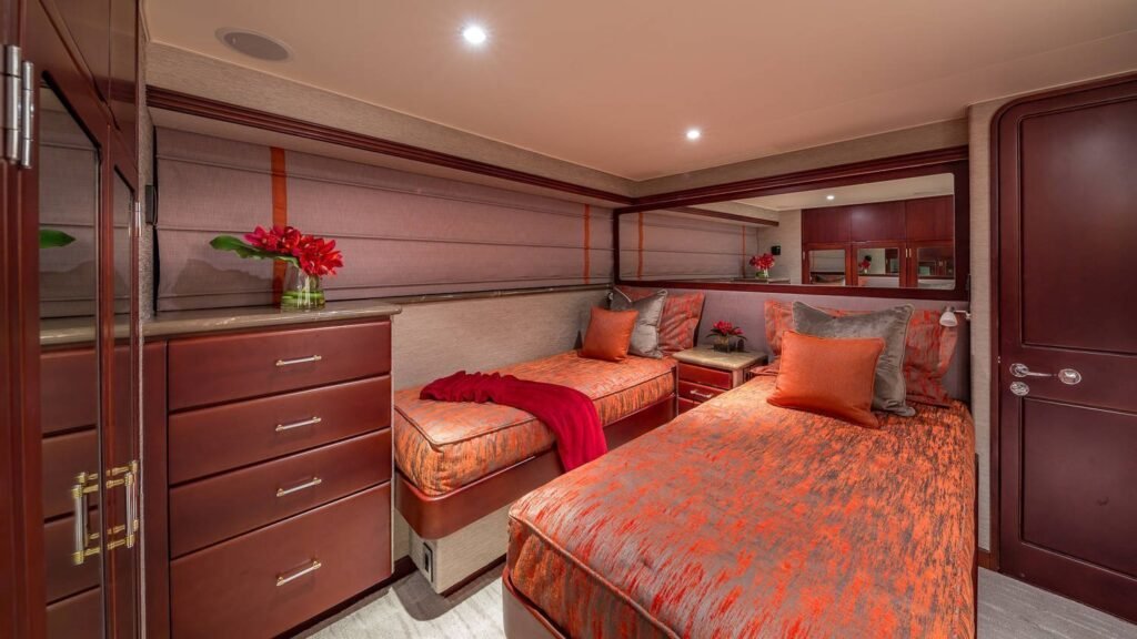 Destiny — twin cabin with coral-tone berths