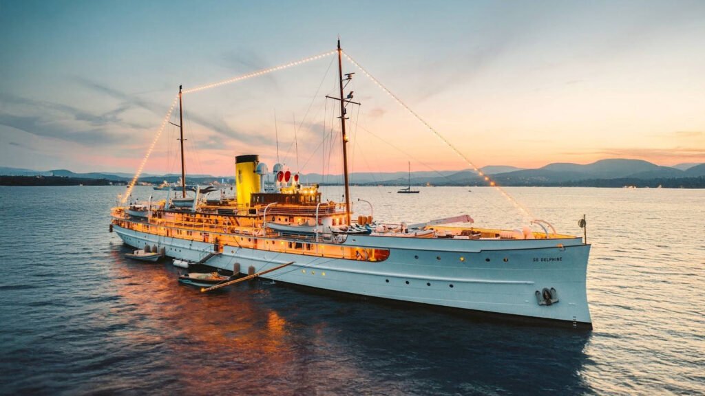 SS DELPHINE yacht Dressed Overall At Dusk