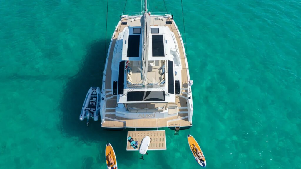 ALISEI - at anchor with the tender and toys astern