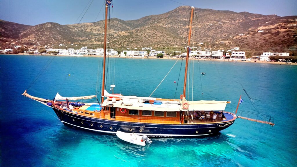 APHRODITE - profile at anchor off a Greek town