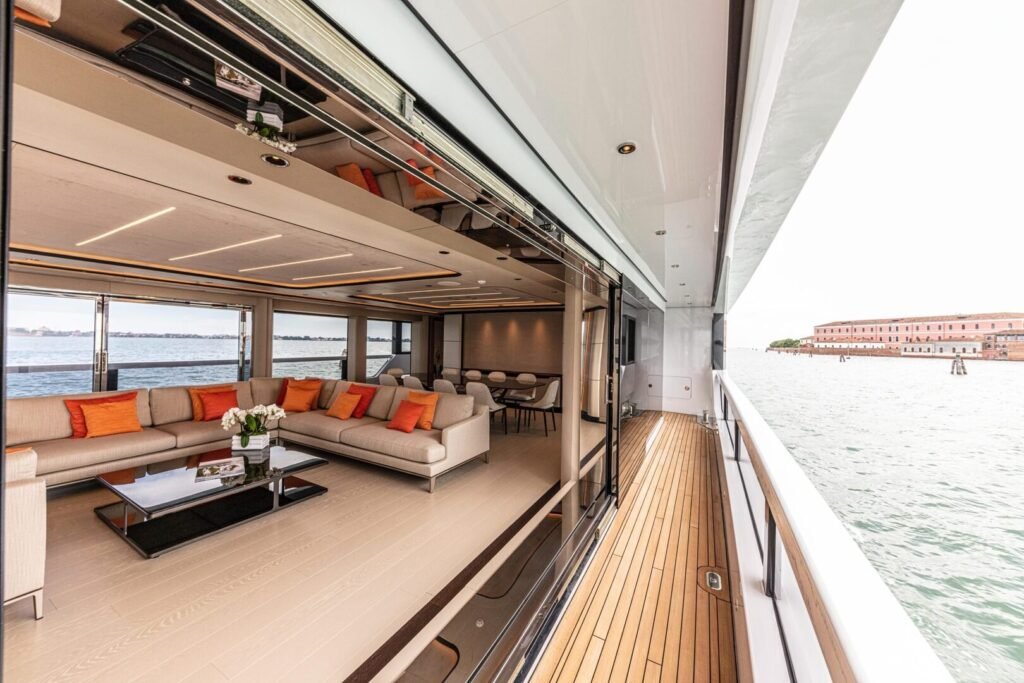 Ocean King Ducale 120 saloon opening to a side terrace
